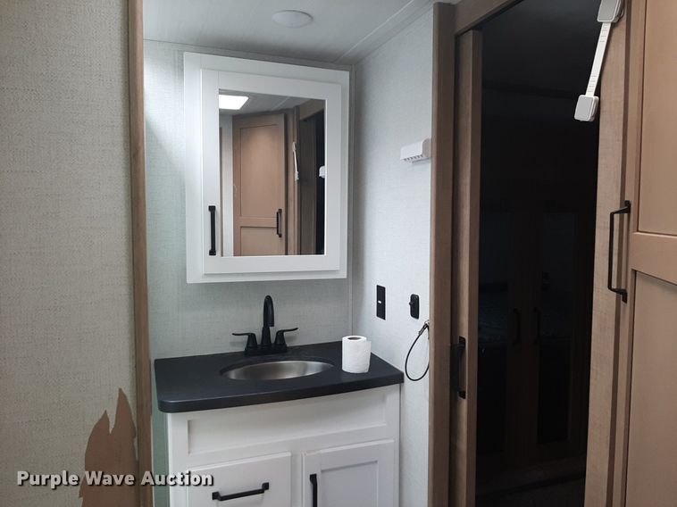 image for item DQ7055 2022 Keystone Raptor toy hauler camper