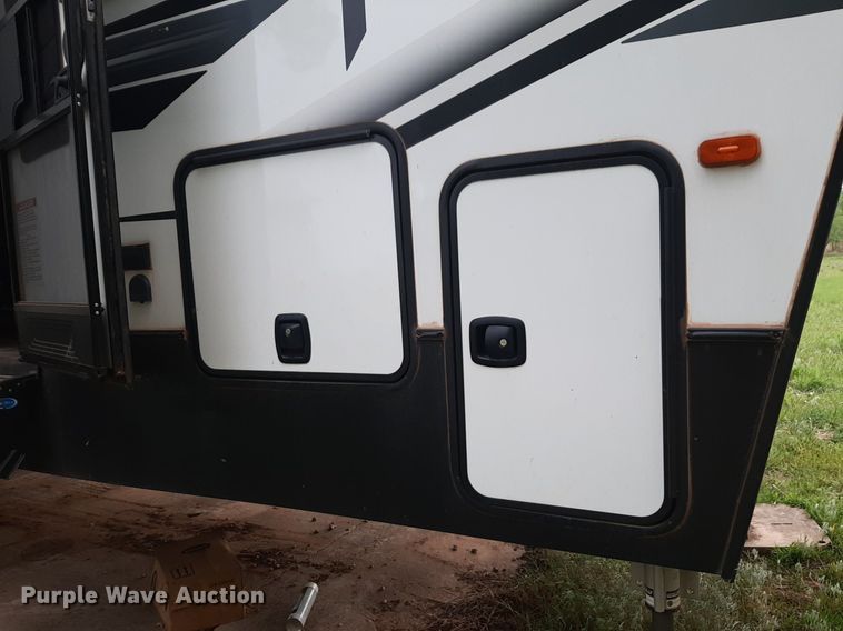 image for item DQ7055 2022 Keystone Raptor toy hauler camper