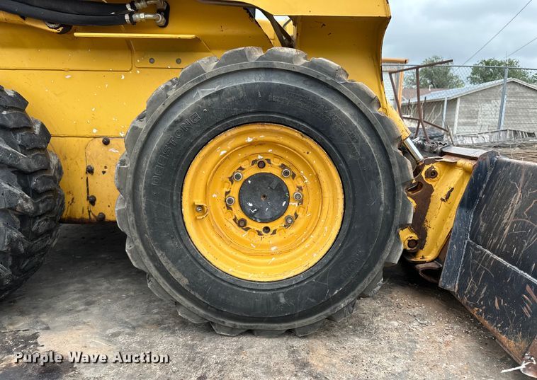 image for item OI9144 1999 John Deere 250 skid steer loader