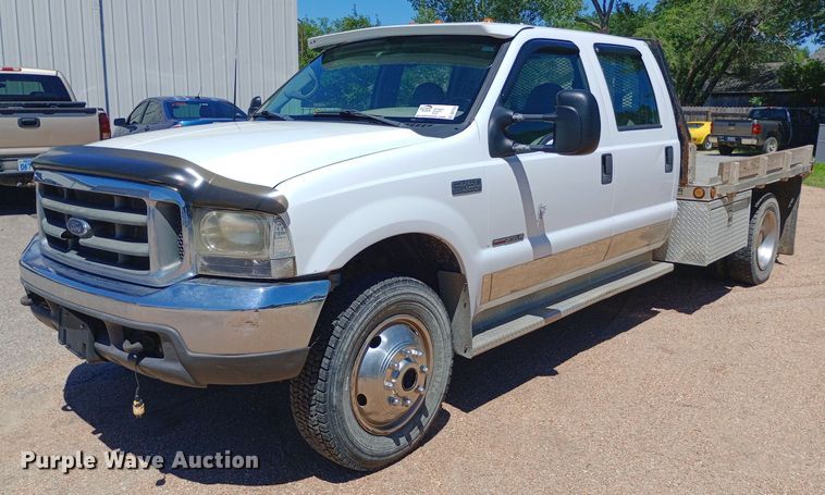 image for item DQ7135 2000 Ford F450 Super Duty Crew Cab flatbed truck