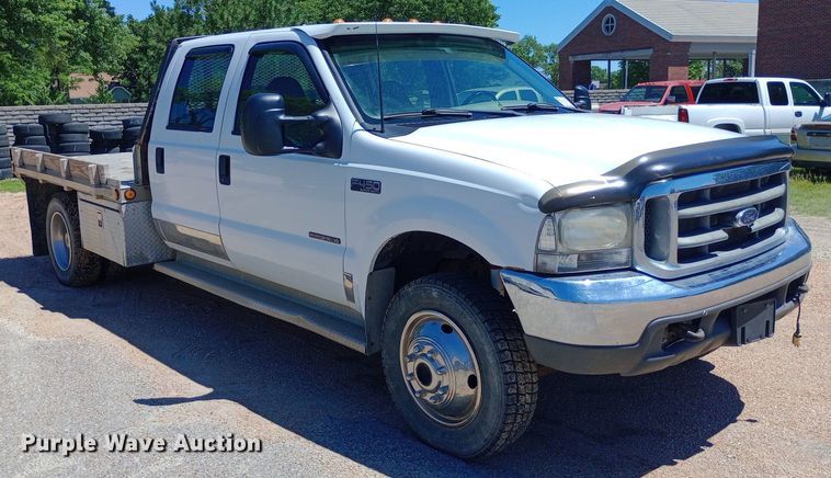 image for item DQ7135 2000 Ford F450 Super Duty Crew Cab flatbed truck