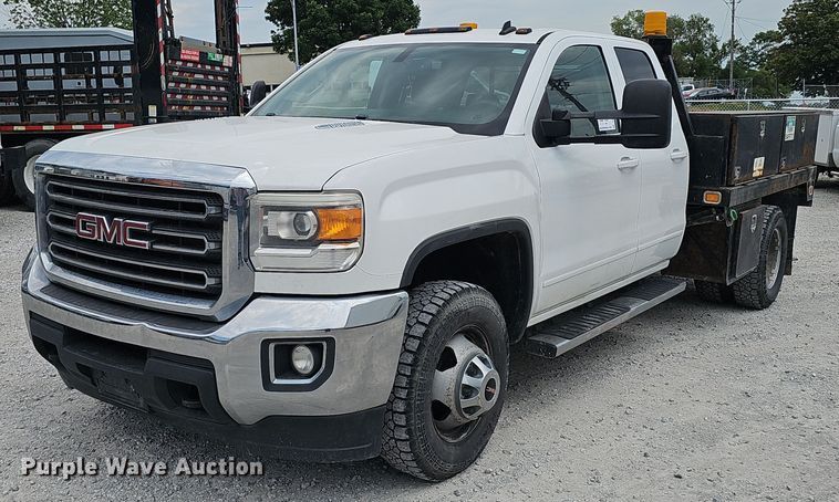 image for item DP1041 2015 GMC  Sierra 3500 Double Cab flatbed pickup truck
