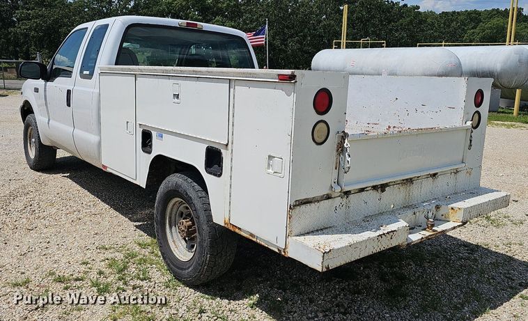 image for item EJ5755 1999 Ford F250 Super Duty SuperCab utility bed pickup truck