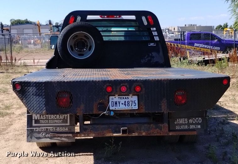 image for item LO9035 2014 Chevrolet Silverado 3500HD Crew Cab flatbed pickup truck