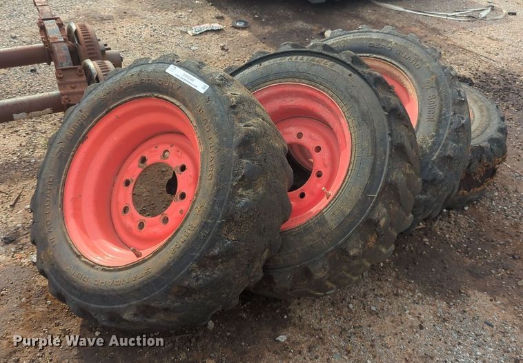 image for item NW9546 (4) 10x16.5 NHS skid steer tires and wheels