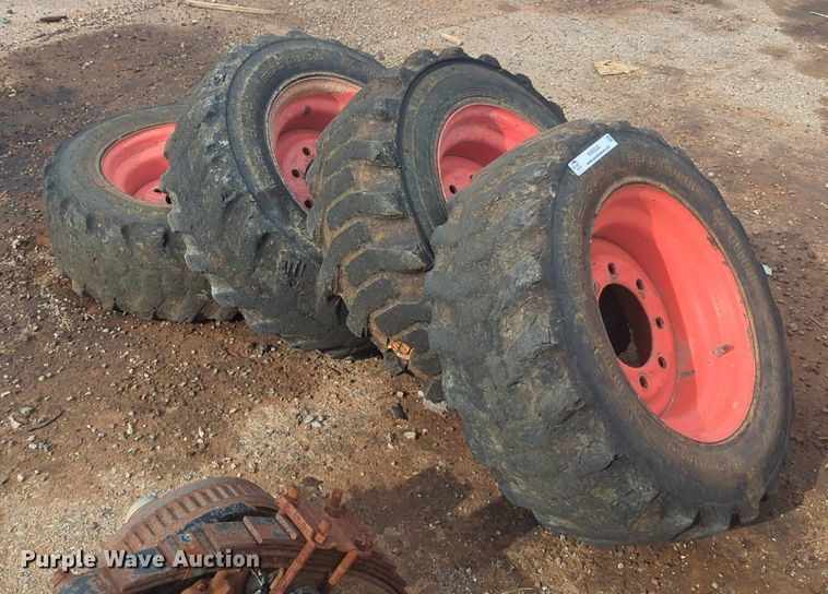 image for item NW9546 (4) 10x16.5 NHS skid steer tires and wheels