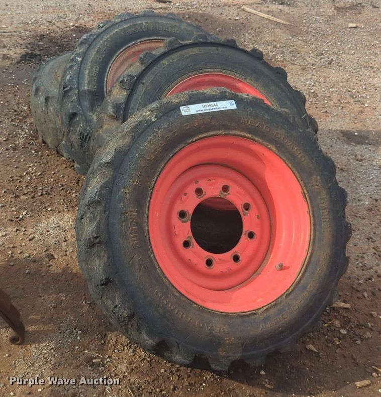 image for item NW9546 (4) 10x16.5 NHS skid steer tires and wheels