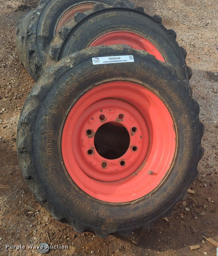 image for item NW9546 (4) 10x16.5 NHS skid steer tires and wheels