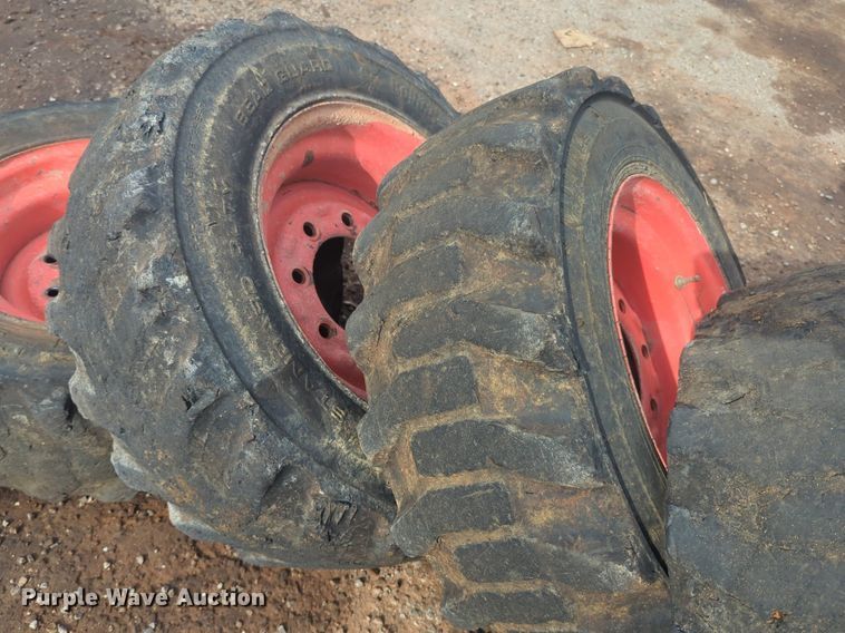 image for item NW9546 (4) 10x16.5 NHS skid steer tires and wheels