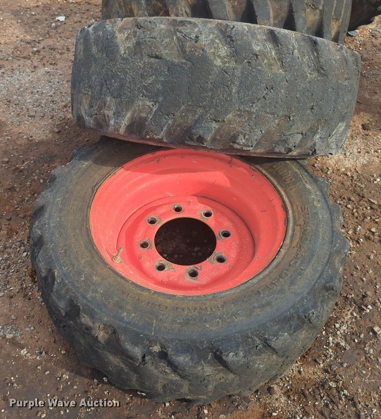 image for item NW9546 (4) 10x16.5 NHS skid steer tires and wheels