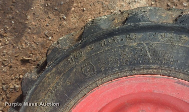 image for item NW9546 (4) 10x16.5 NHS skid steer tires and wheels