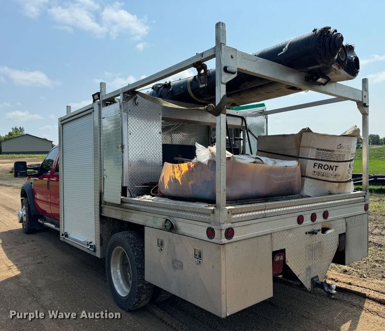 image for item NB9514 2009 Ford  F450 Super Duty XLT Crew Cab flatbed truck