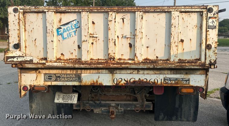 image for item EG0557 2006 Ford F450 Super Duty Crew Cab dump flatbed truck