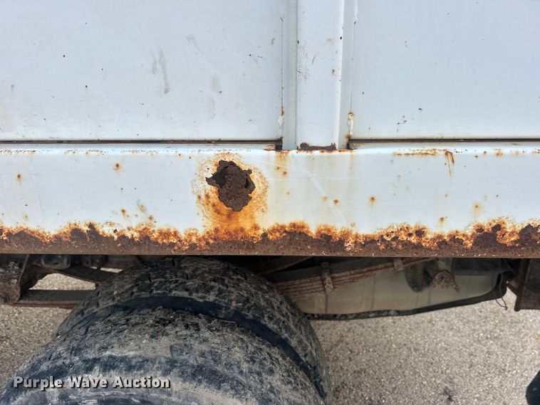 image for item EG0557 2006 Ford F450 Super Duty Crew Cab dump flatbed truck