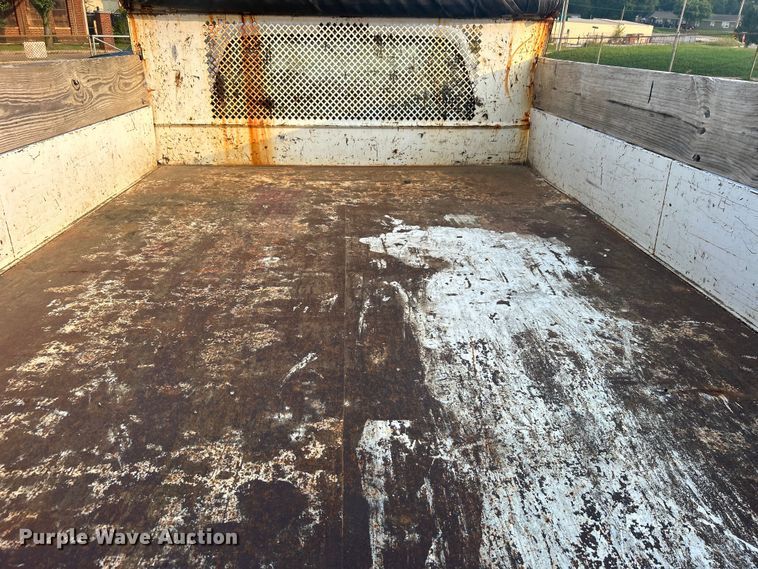 image for item EG0557 2006 Ford F450 Super Duty Crew Cab dump flatbed truck