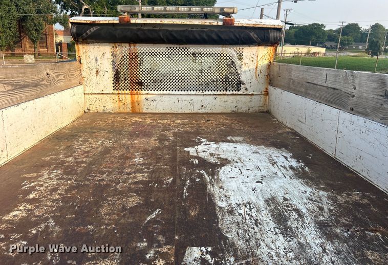 image for item EG0557 2006 Ford F450 Super Duty Crew Cab dump flatbed truck