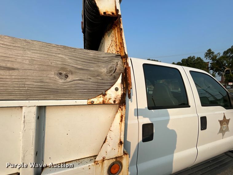 image for item EG0557 2006 Ford F450 Super Duty Crew Cab dump flatbed truck