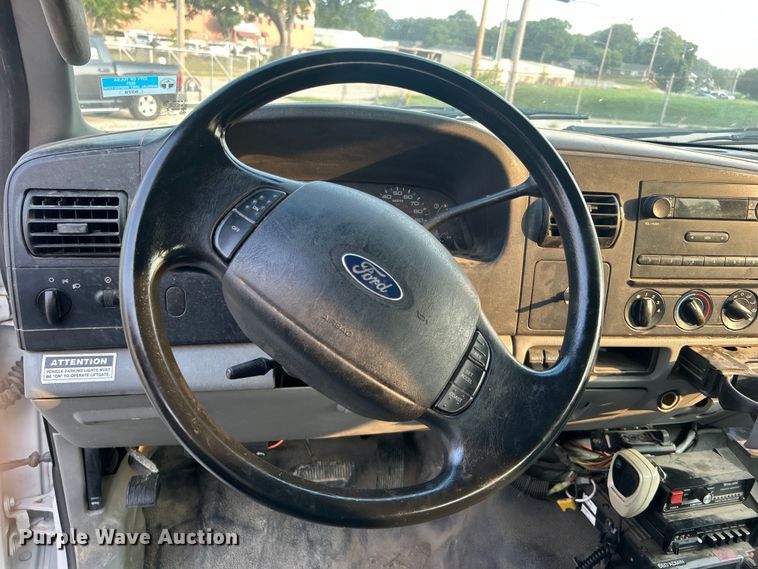 image for item EG0557 2006 Ford F450 Super Duty Crew Cab dump flatbed truck