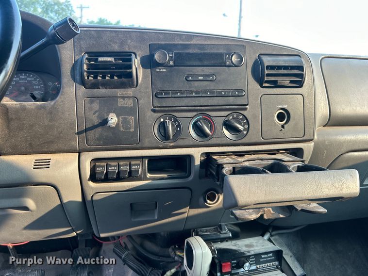 image for item EG0557 2006 Ford F450 Super Duty Crew Cab dump flatbed truck