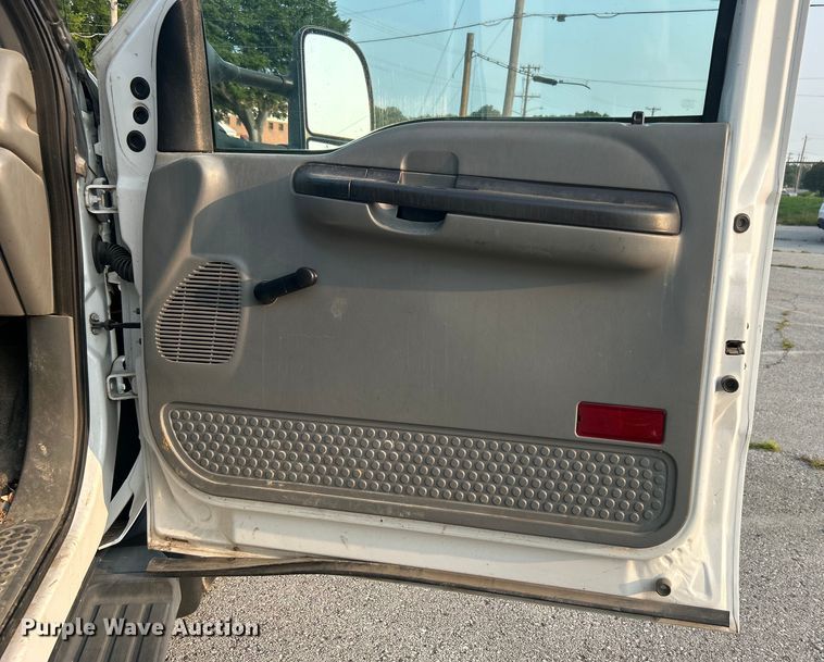 image for item EG0557 2006 Ford F450 Super Duty Crew Cab dump flatbed truck