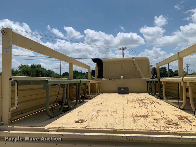 image for item DM7965 1994 Stewart & Stevenson M1078 flatbed truck