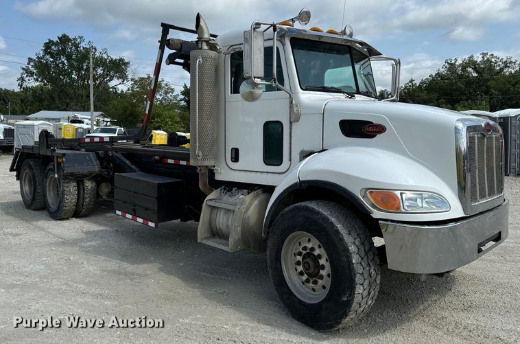 image for item OF9915 2006 Peterbilt 335 roll-off container truck