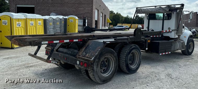 image for item OF9915 2006 Peterbilt 335 roll-off container truck