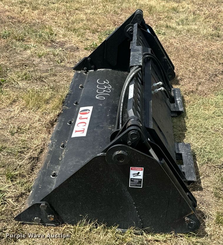 image for item DX1197 JCT Attachments four-in-one skid steer bucket