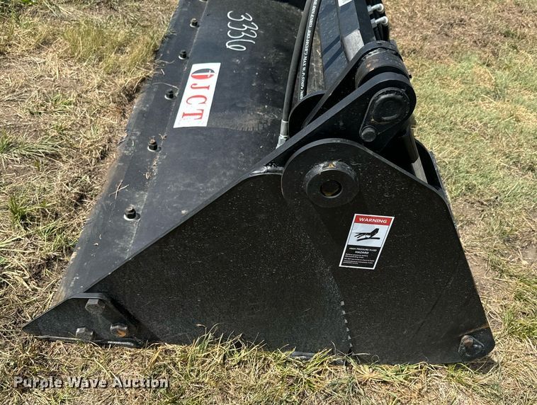 image for item DX1197 JCT Attachments four-in-one skid steer bucket