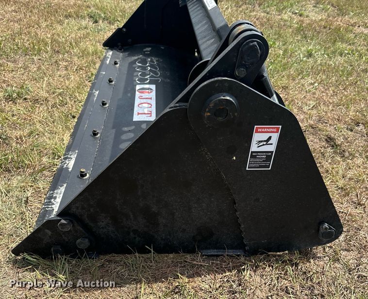 image for item DX1198 JCT Attachments four-in-one skid steer bucket