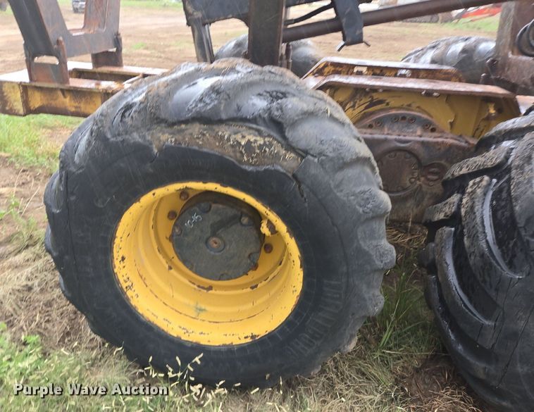 image for item LG9014 2001 Caterpillar 574 forwarder