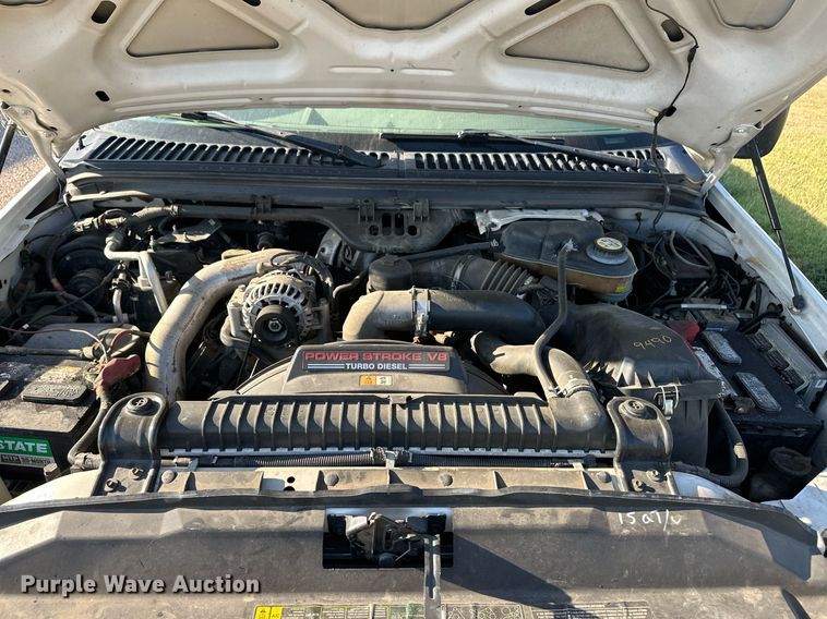 image for item OM9719 2005 Ford F350 Super Duty SuperCab flatbed pickup truck