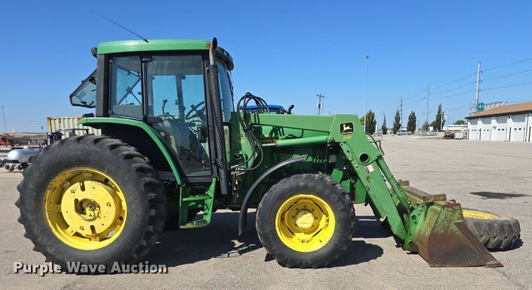 image for item DQ4605 1998 John Deere  6310 MFWD tractor
