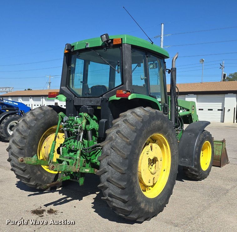 image for item DQ4605 1998 John Deere  6310 MFWD tractor