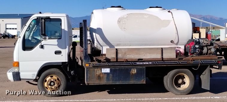 image for item DQ6172 2002 Isuzu  NPR flatbed truck