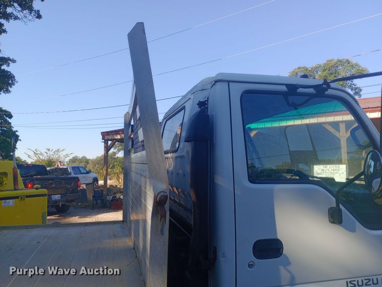 image for item DW0767 1996 Isuzu  NPR flatbed truck