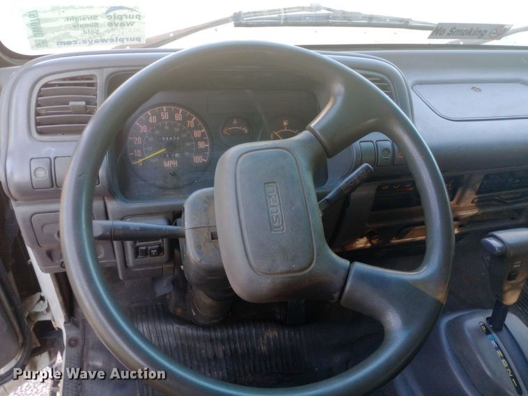 image for item DW0767 1996 Isuzu  NPR flatbed truck