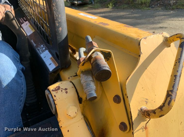 image for item JT9750 1999 John Deere  240 skid steer loader