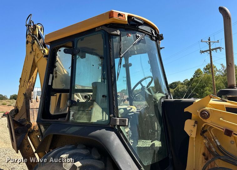image for item EJ4879 1998 John Deere 310SE backhoe