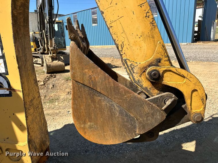 image for item EJ4879 1998 John Deere 310SE backhoe