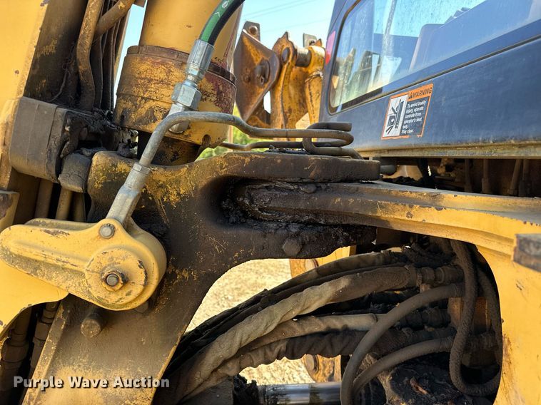 image for item EJ4879 1998 John Deere 310SE backhoe