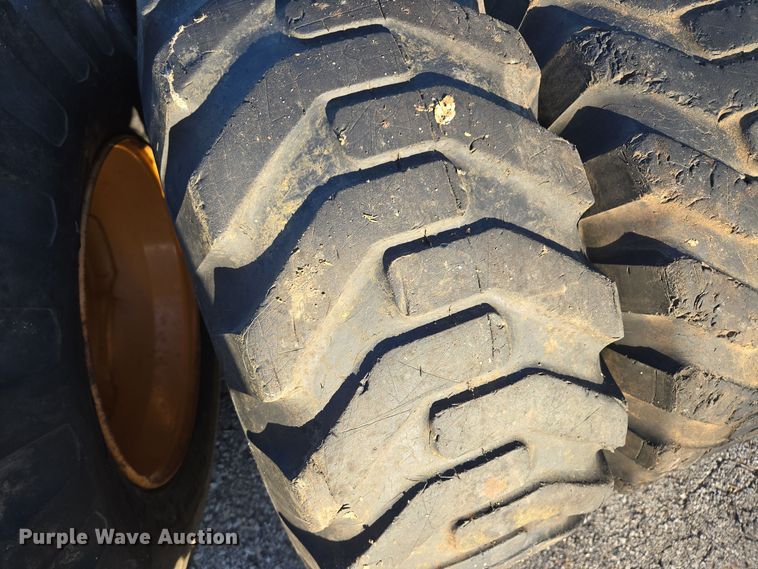 image for item EE8677 (9) 12-16.5 tires and wheels