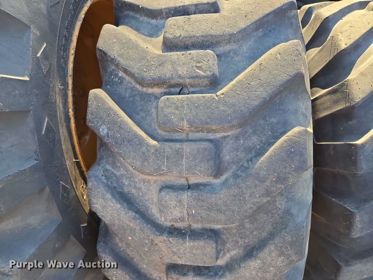 image for item EE8677 (9) 12-16.5 tires and wheels