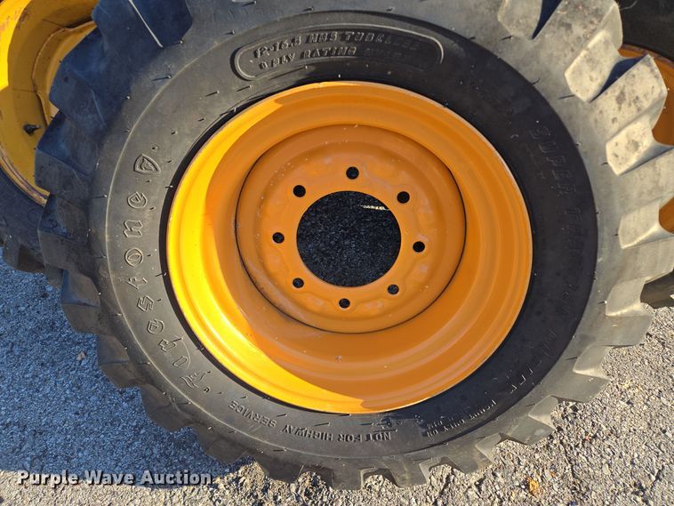 image for item EE8677 (9) 12-16.5 tires and wheels