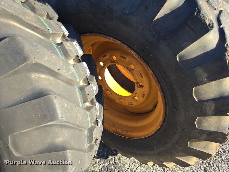 image for item EE8677 (9) 12-16.5 tires and wheels