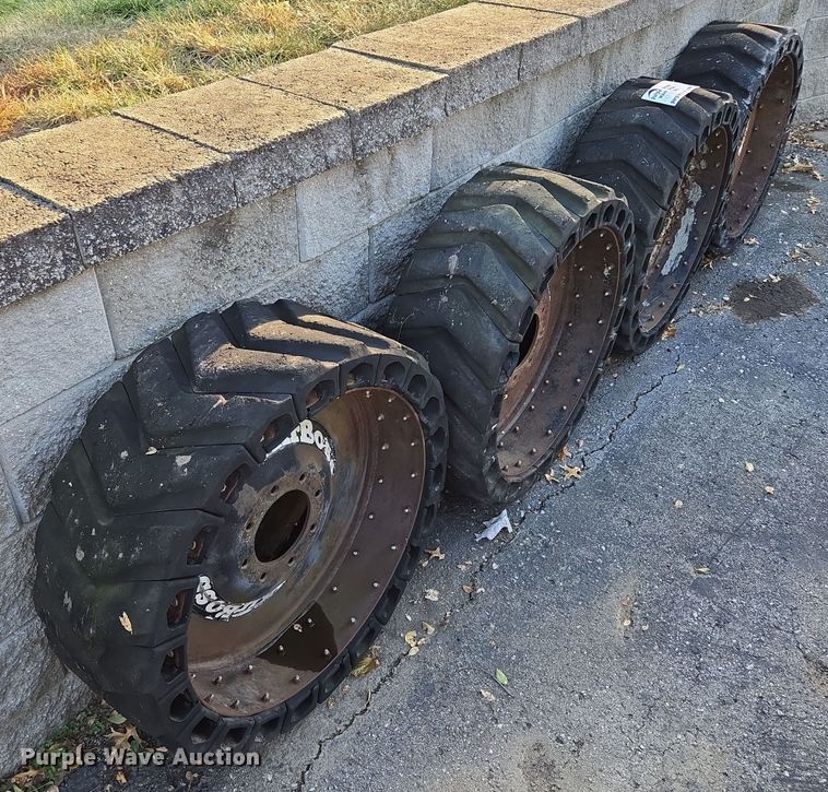 image for item EE8678 (4) skid steer solid tires and wheels