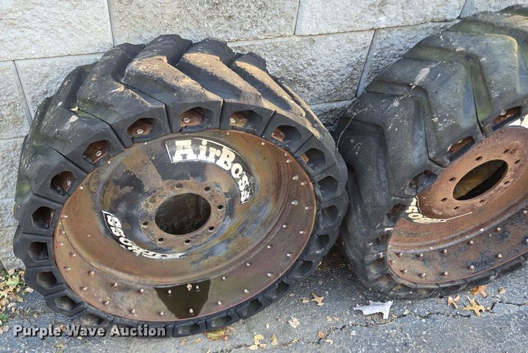 image for item EE8678 (4) skid steer solid tires and wheels