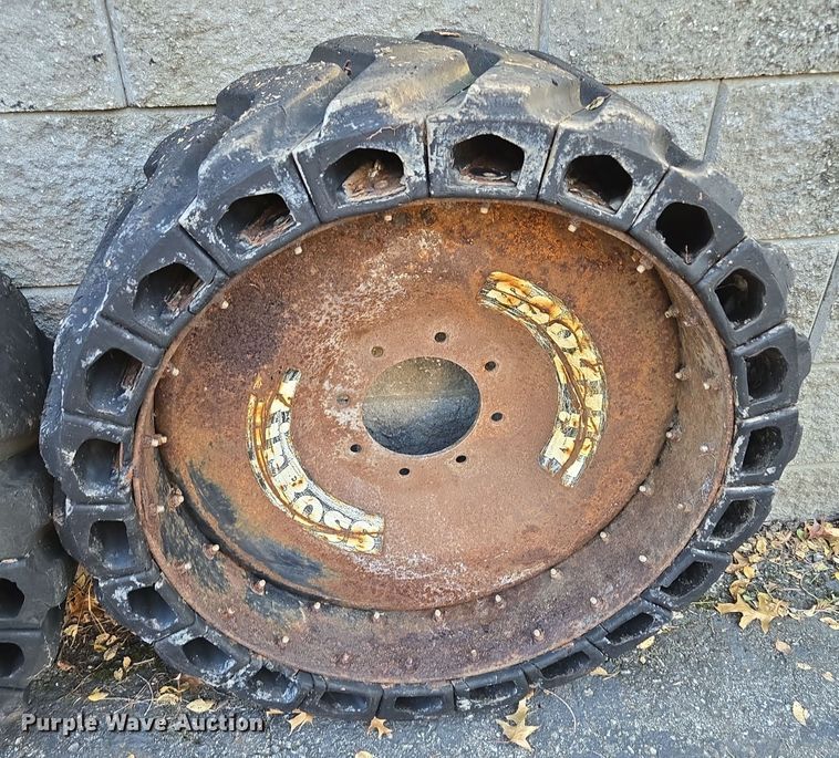 image for item EE8678 (4) skid steer solid tires and wheels