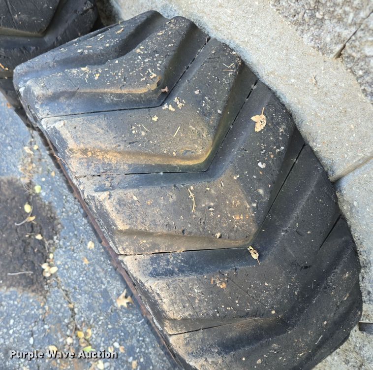 image for item EE8678 (4) skid steer solid tires and wheels