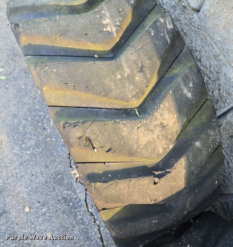 image for item EE8678 (4) skid steer solid tires and wheels